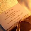 Cream rose embossed paper with ribbon detail wedding invitation